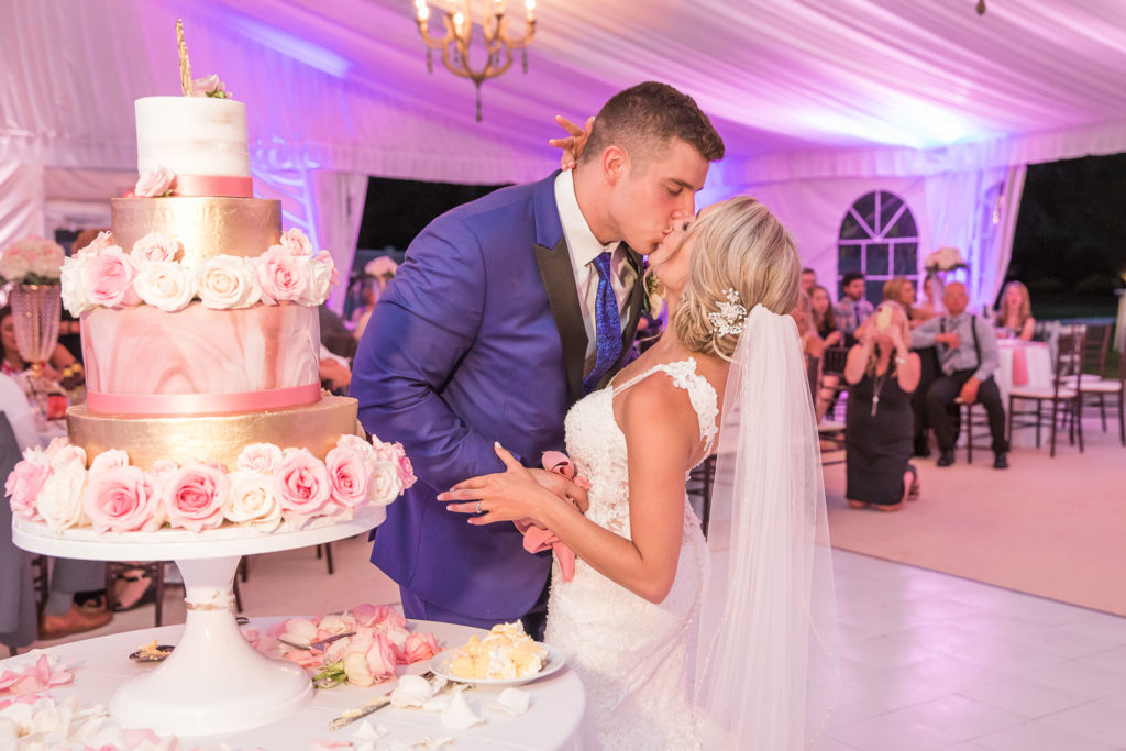 The Villa – The Tent | Bride and Groom Kiss at Cake Cutting | Lisa Ann Photography