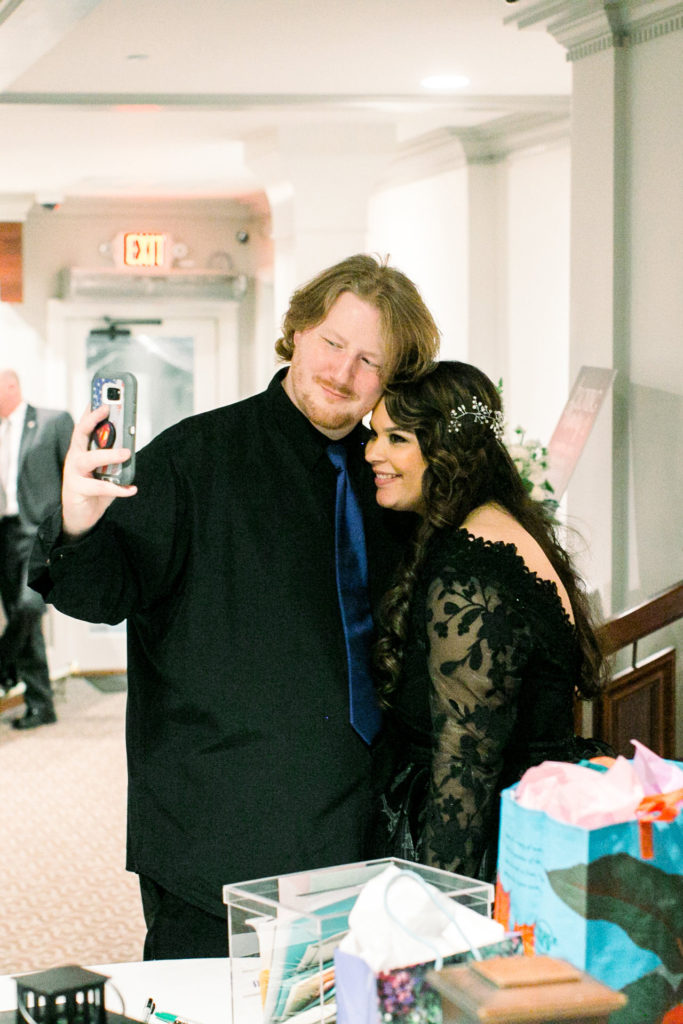 bride and groom taking selfie
