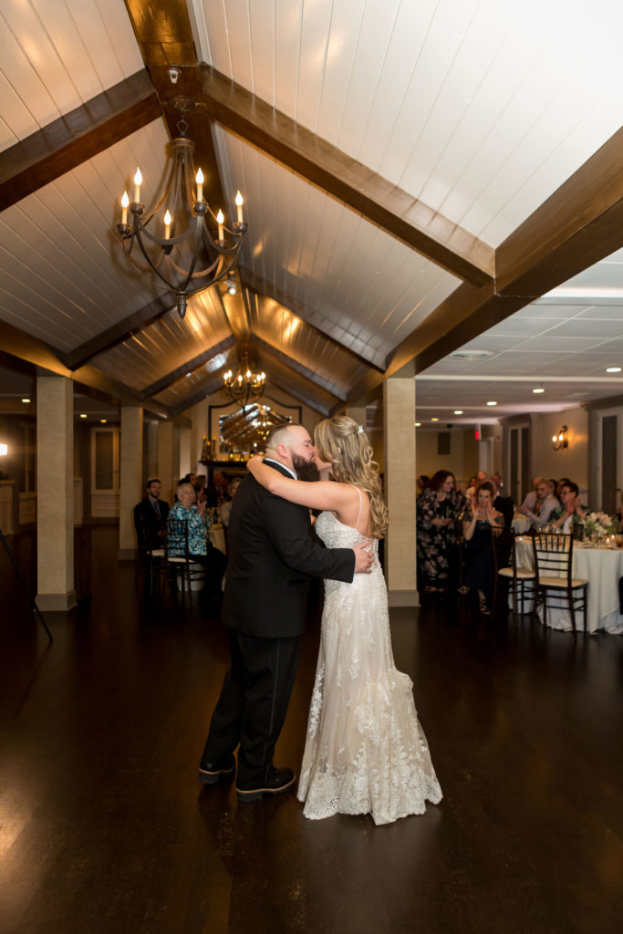 bride and groom first dance in ballroom
