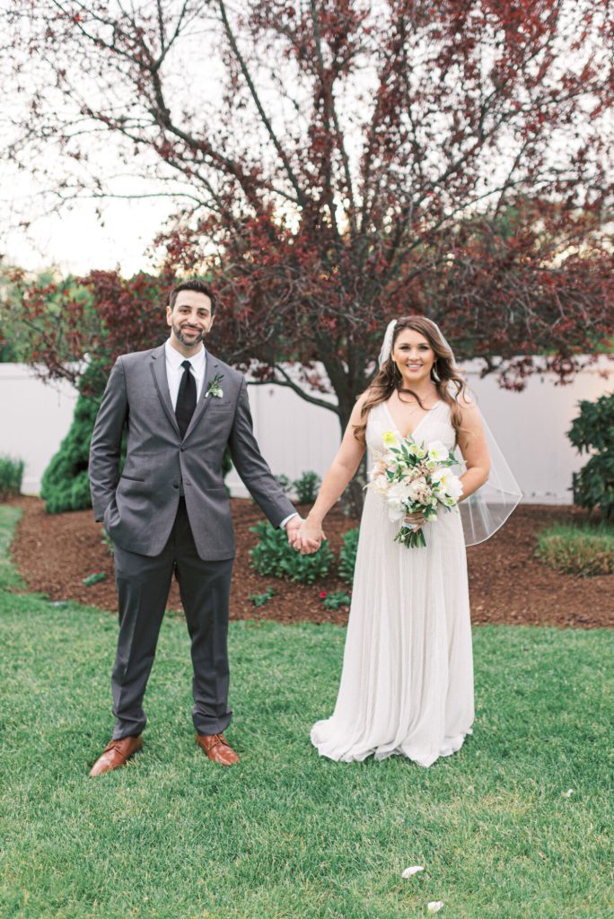 villa-tent-may-wedding-bride-and-groom-holding-hands