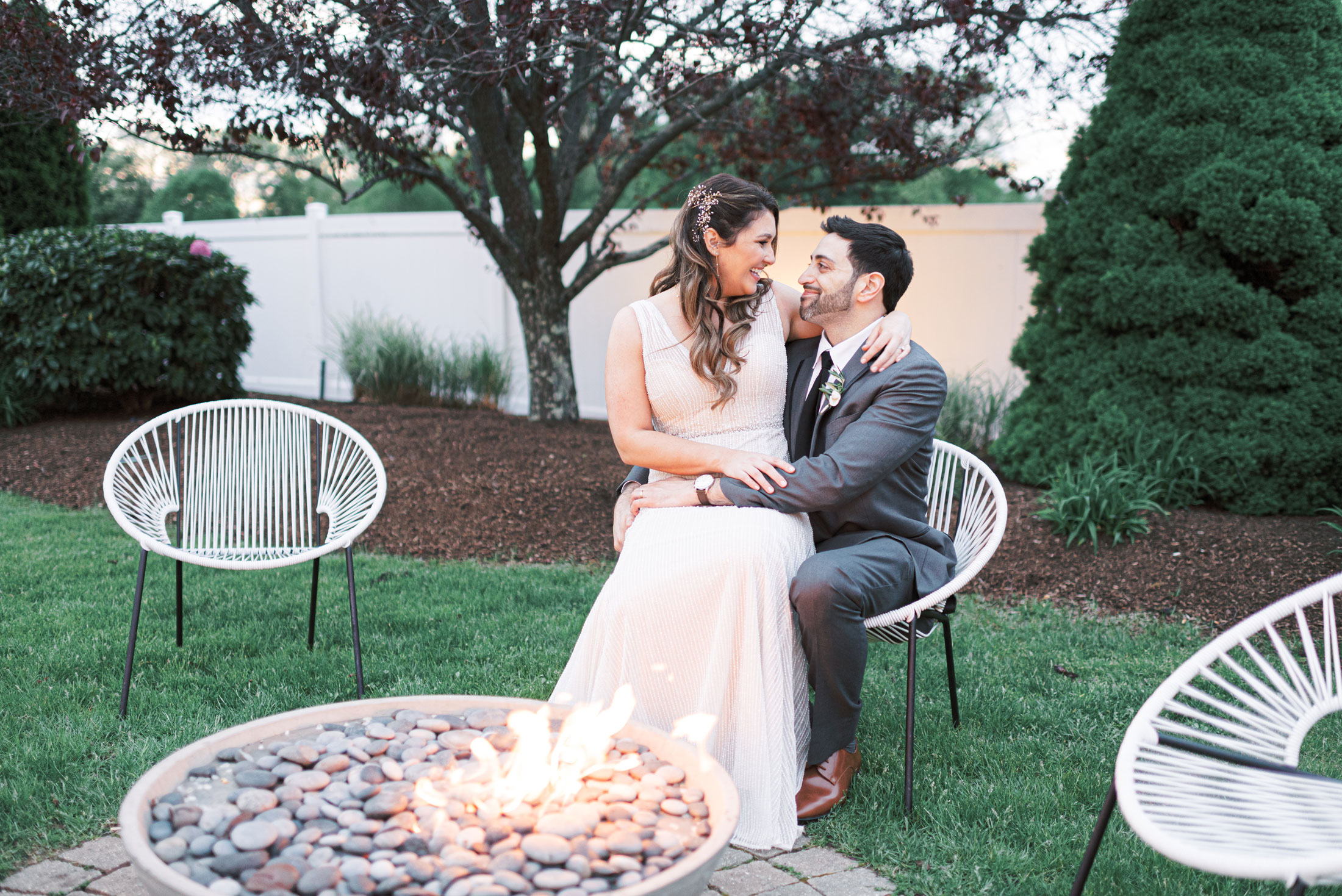 Wedding Couple Sitting by Fire Pit | Stephanie Vegliante Photography