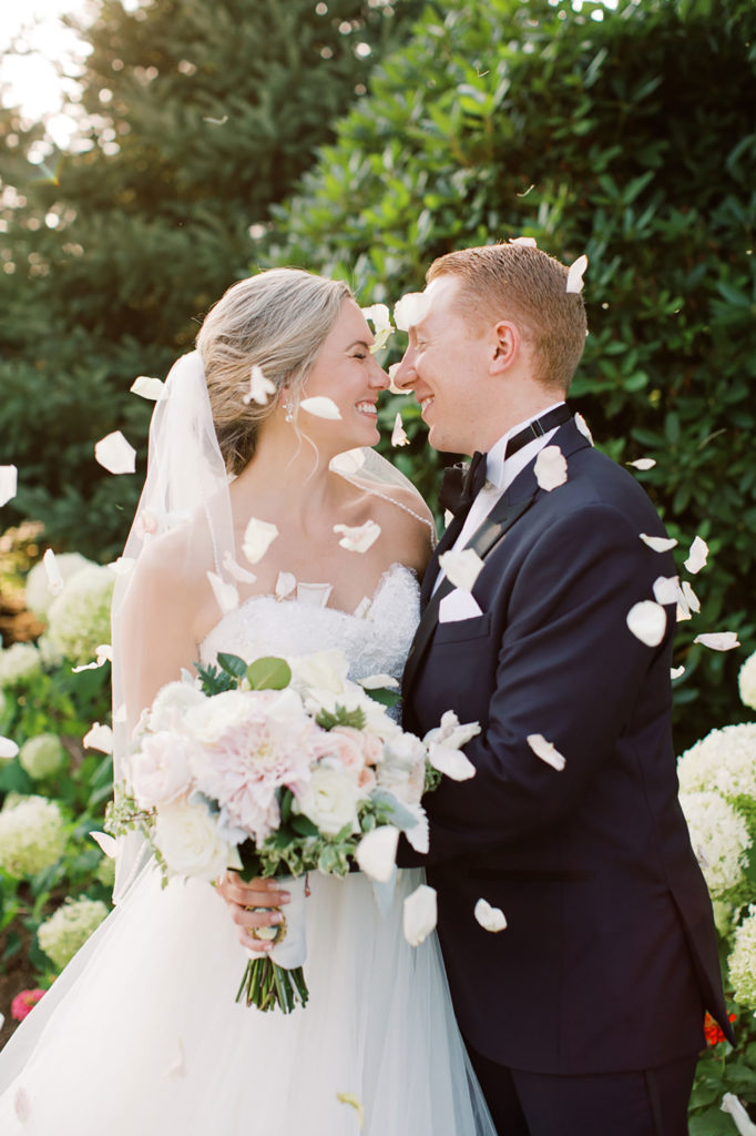 bride and groom portrait with flower petals