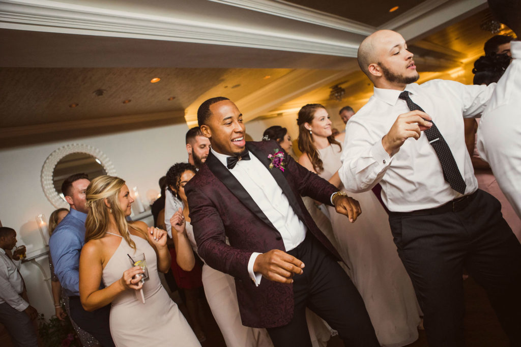 groom dancing at reception