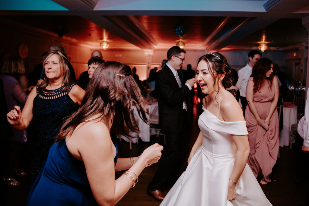 bride and guests dancing