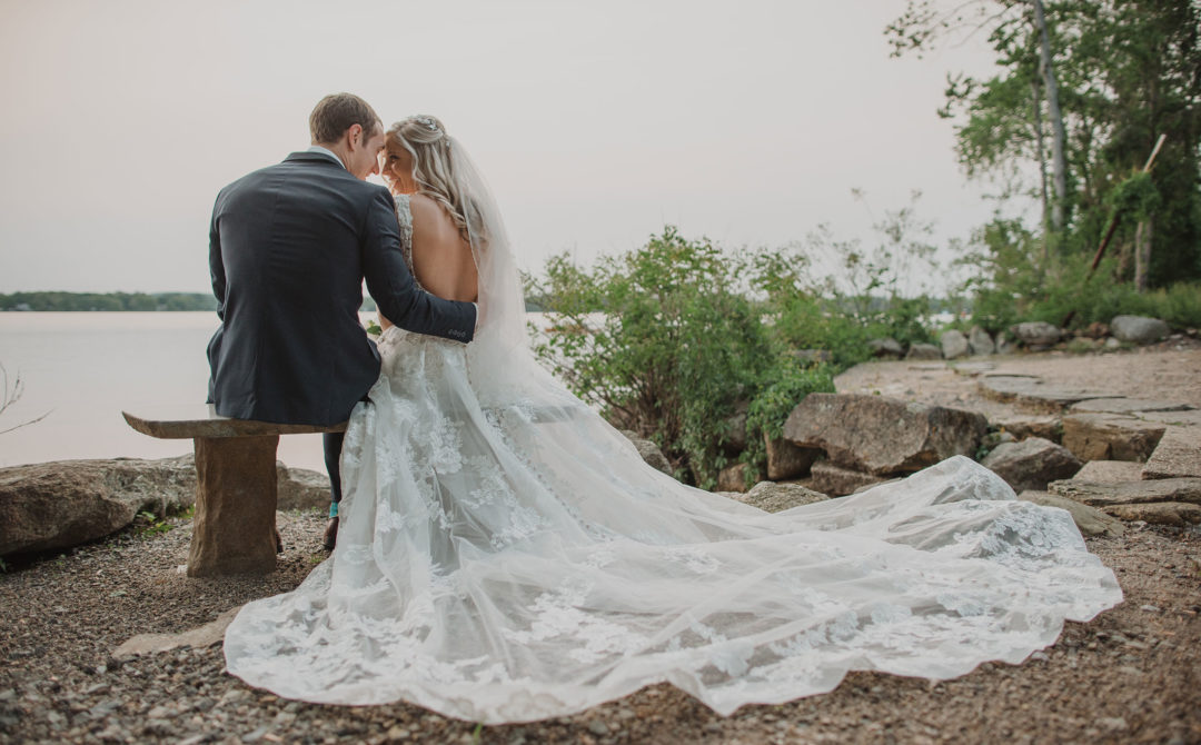 bride and groom at the lake