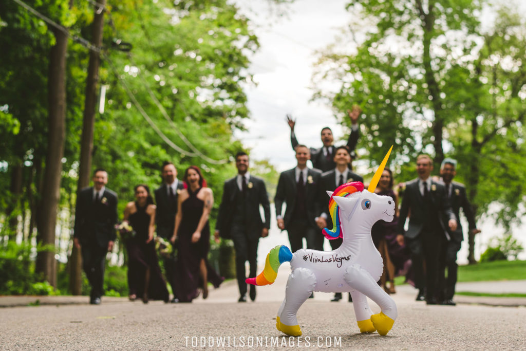 Wedding party walking with unicorn