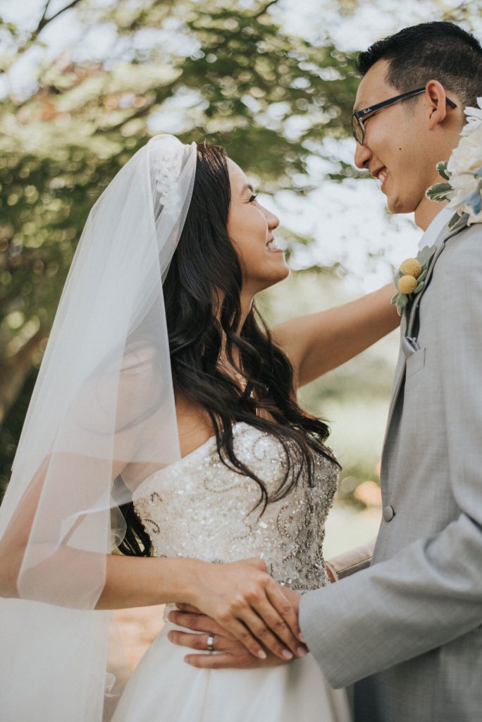 the-villa-grand-ballroom-july-wedding-cherry-and-dan-holding-each-other