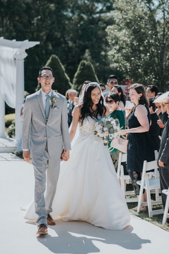 the-villa-grand-ballroom-july-wedding-cherry-and-dan-walking-up-aisle-after-ceremony