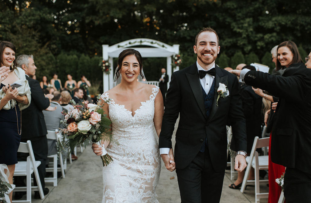 bride and groom walking down aisle