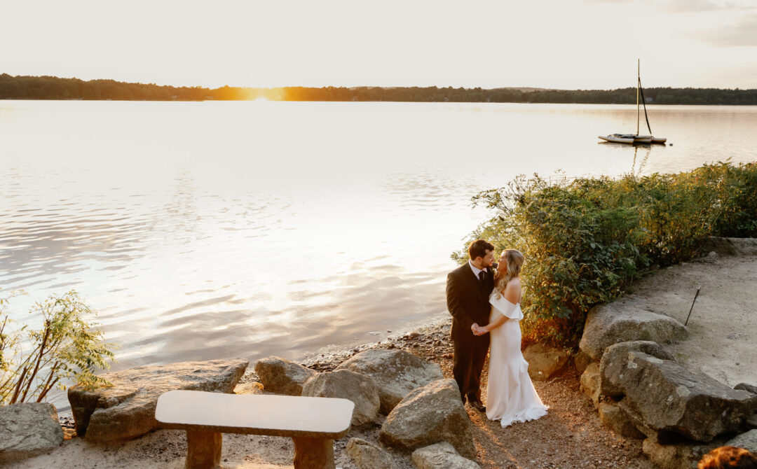 Bride and groom by Lake Massapoag