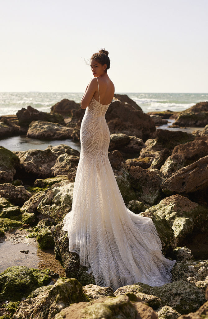 Bride modeling a 2023 Dana Harel wedding dress with sheer accents
