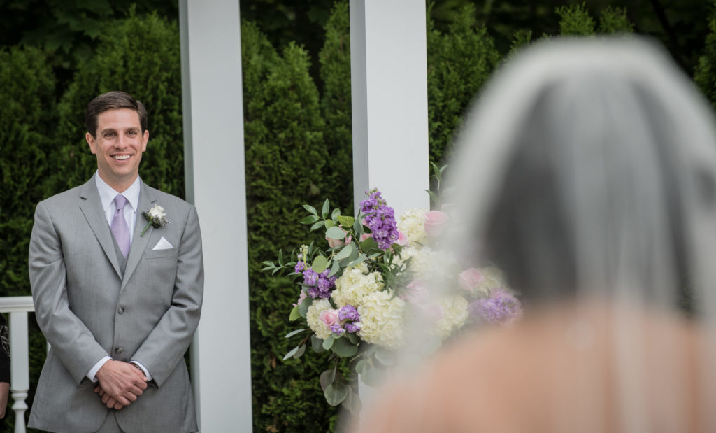 Groom reacts to his bride walking down the aisle instead of doing a first look