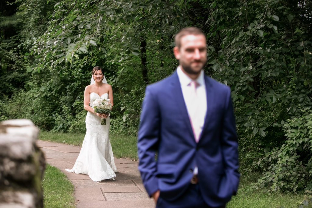 Bride and groom do first look before outdoor wedding ceremony Boston Massachusetts wedding venue