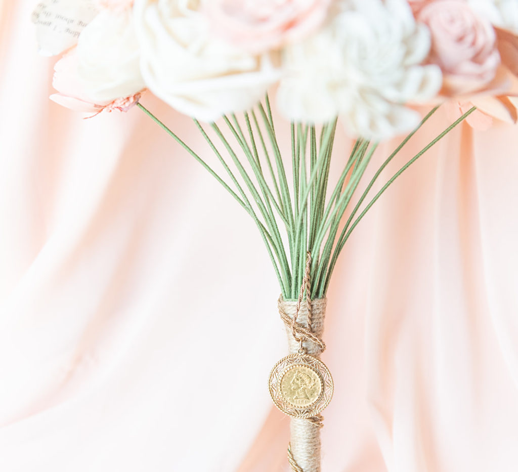 Wedding tradition sixpence in shoe for luck on bridal bouquet 