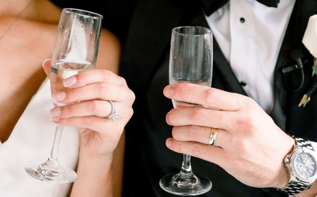 Bride and Groom Holding Champagne Glasses
