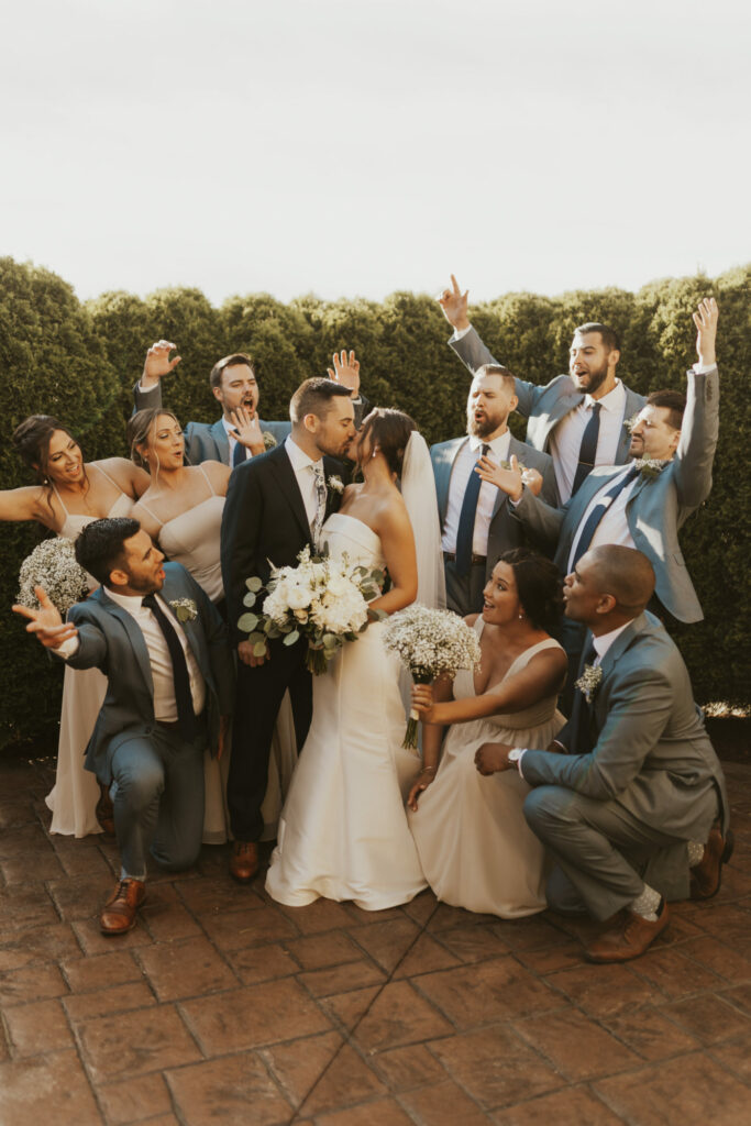 Bridal party cheers on bride and groom at The Villa in East Bridgewater, Massachusetts