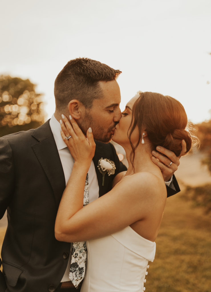 Bride and groom kiss at The Villa in East Bridgewater, Massachusetts