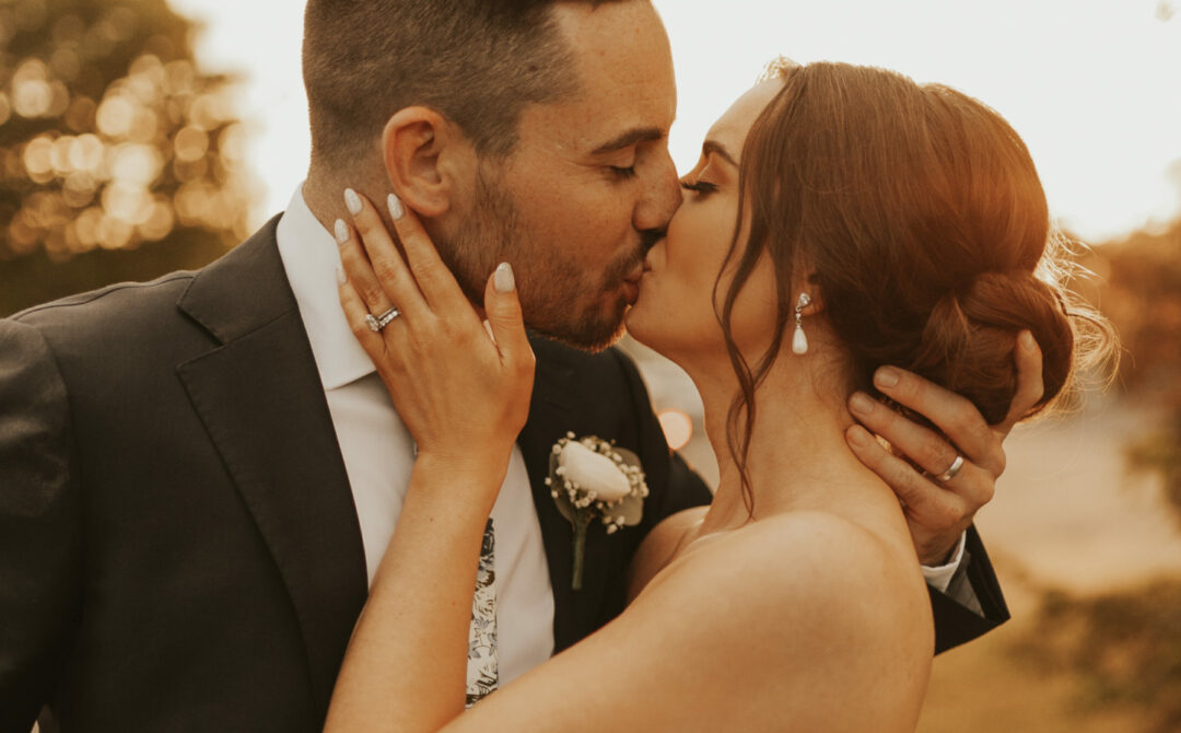 Bride and groom kiss at The Villa in East Bridgewater, Massachusetts