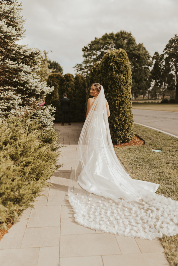 Bride with long veil at The Villa in East Bridgewater, Massachusetts