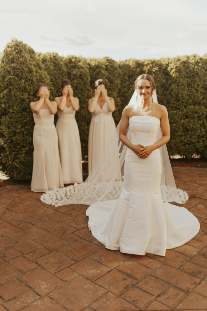 Bride and bridesmaids first look on her wedding day at The Villa