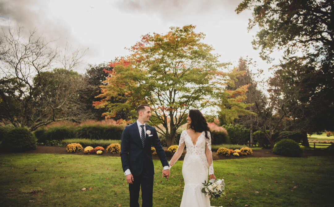 Bride and groom walk grounds at The Villa in East Bridgewater, Massachusetts
