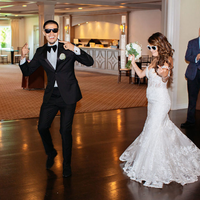 Bride and groom dancing to a wedding reception entrance song