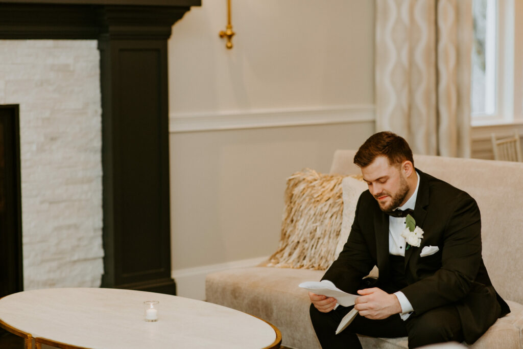 Groom Reading Letter From Bride in Cocktail Space