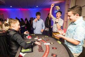 Saphire Event Group employee excited about winning black jack at the employee appreciation casino night