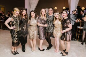 Wedding guests dressed in flapper dresses and gatsby attire