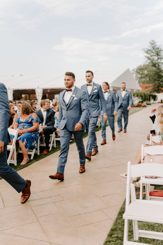 Groomsmen Walk Down the Aisle at Outdoor Ceremony