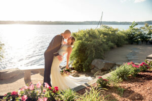 Bride and Groom Kiss By Lake Massapoag in Sharon Massachusetts