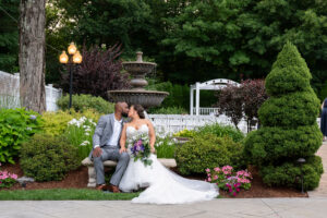 Bride and Groom Kiss in Front of Fountain in Sharon Massachusetts