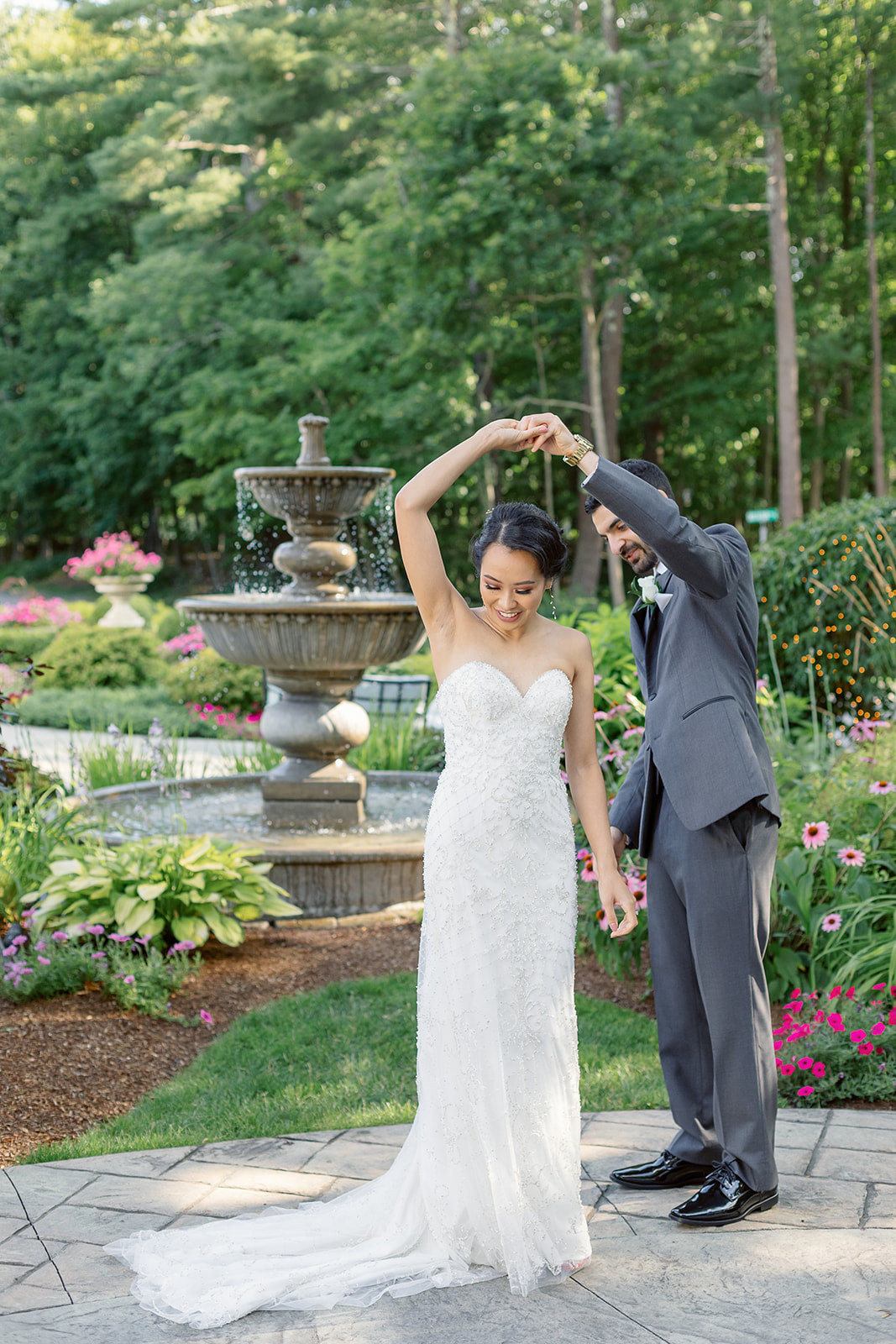 outdoor water fountain wedding photo of bride and groom