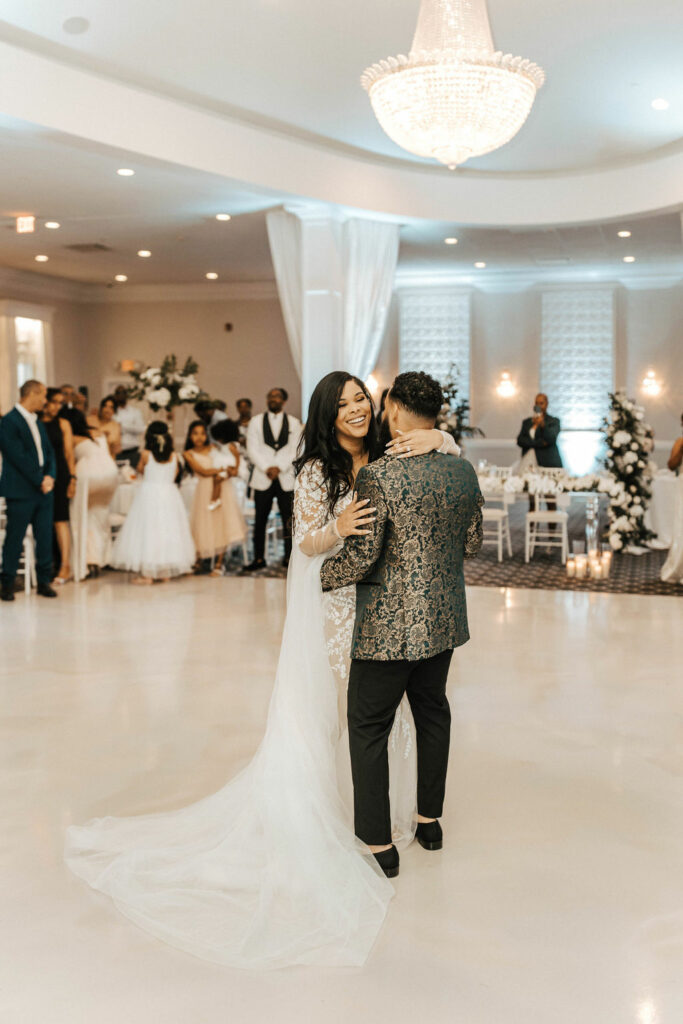 Bride and Groom First Dance in White Ballroom