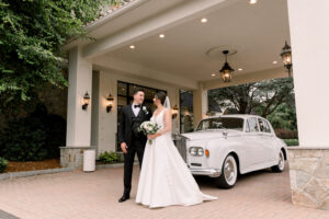 bride and groom with vintage car 