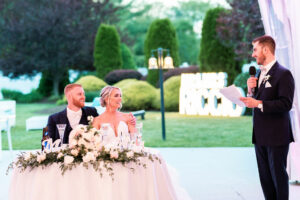 Bride and Groom Laugh During Best Man's Wedding Toast at The Villa in East Bridgewater MA