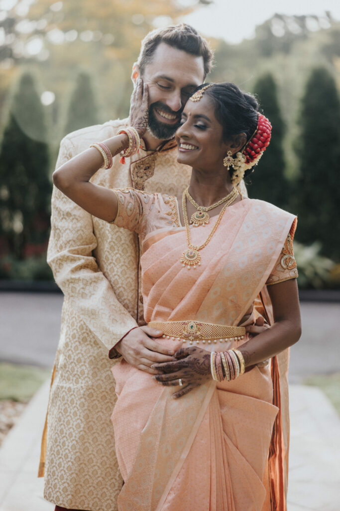 Bride and Groom Wearing Peach and Beige Sari and Sherwani at Avenir in Massachusetts