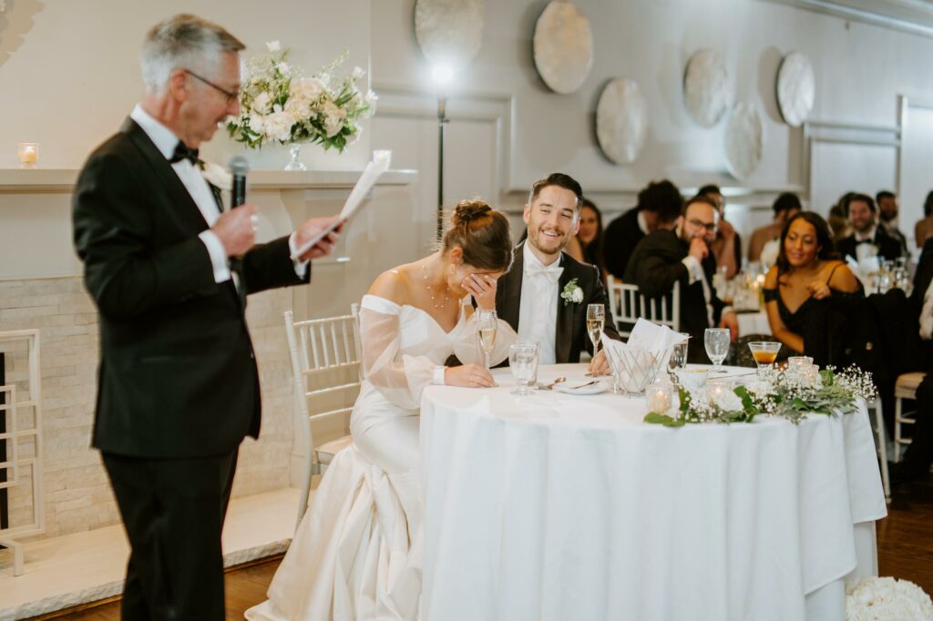 Bride and Groom Laugh During Fathers Wedding Toast at Saphire Estate in Sharon Massachusetts