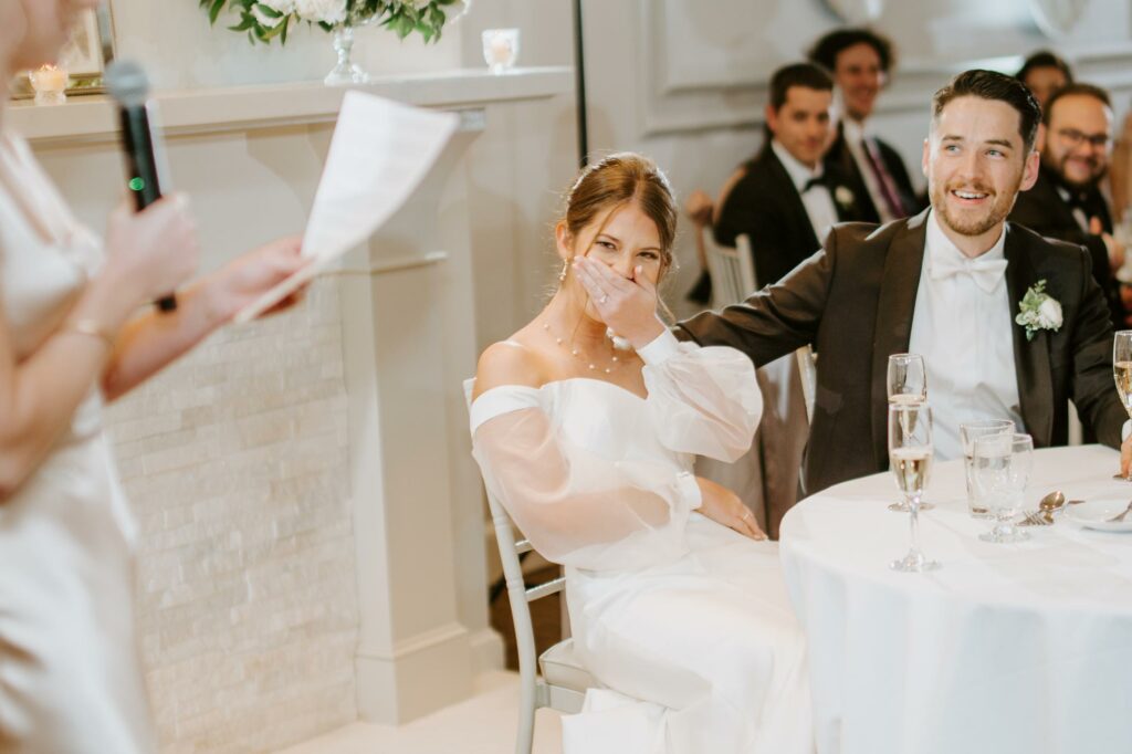 Bride Laughs During Her Fathers Wedding Toast at Saphire Estate