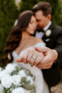 Detailed Wedding Band and Engagement Ring with Bride and Groom