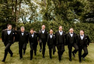 Groomsmen Skip and Laugh at Wedding at Avenir in Walpole Massachusetts