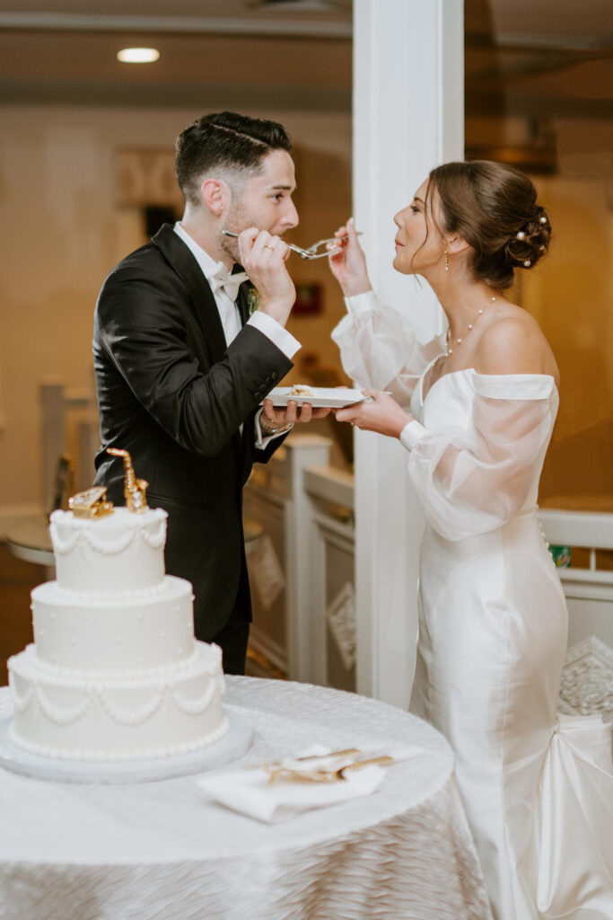 Bride and Groom Share Wedding Cake at Saphire Estate in Sharon Massachusetts