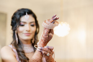 Bride Wearing Bridal Henna and Gold Jewelry at Saphire Estate in Sharon Massachusetts
