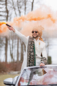 Indian Groom Arrives in Luxury Car During Baraat at Saphire Estate with Orange Smoke