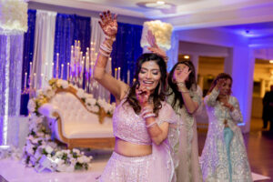 Indian Bride and Bridesmaids in Purple Sari Dance at Wedding Reception at Saphire Estate