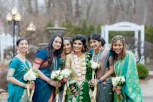 Indian Bride and Bridesmaids Wearing Green and Gold Saris Outside at Saphire Estate in Sharon Massachusetts