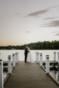 Bride and Groom on Dock at Sunset at The Lakehouse in Halifax Massachusetts