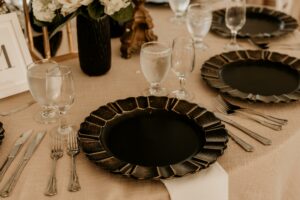 Rustic Black Wedding Chargers on Beige Table Linens