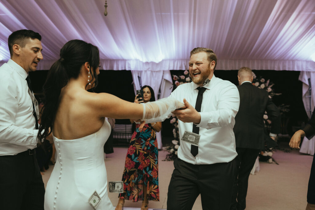 Bride and Groom Dancing and Laughing at Reception
