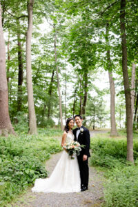 Bride and Groom Portrait at Historic Saphire Estate Wooded Pathway 